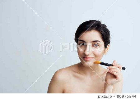 brunette with bare shoulders out for makeup facials brunette with bare shoulders out for makeup facials 80975844