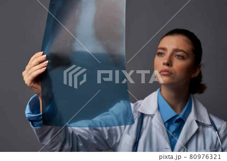 female doctor x-ray take a follow-up gown health professional job female doctor x-ray take a follow-up gown health professional job 80976321