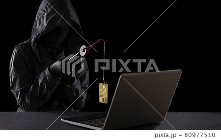 Internet fraud using computer technology, theft of money on the Internet, theft of credit card data. Hacker stole a credit card with a fishing rod Internet fraud using computer technology, theft of money on the Internet, theft of credit card data. Hacker stole a credit card with a fishing rod 80977510