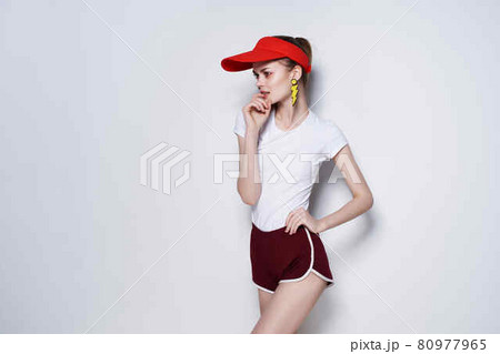 cheerful girl in red cap mesh decoration posing summer fashion 80977965
