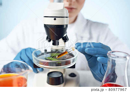 woman laboratory assistant microscope research biotechnology medicine 80977967