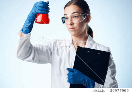 Woman in white coat medicine biotechnology laboratory 80977969