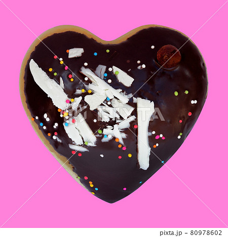 Heart shaped donut isolated on pink background Heart shaped donut isolated on pink background 80978602