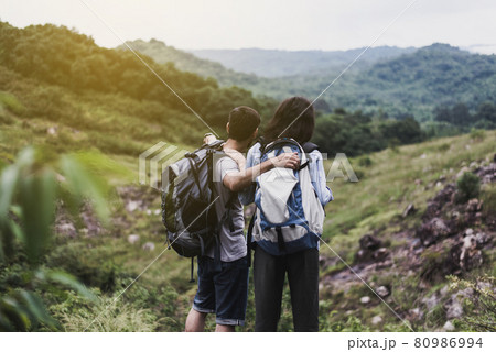 Couple lover standing and looking beautiful view feeling happy and smiling together,Enjoying camping in nature 80986994