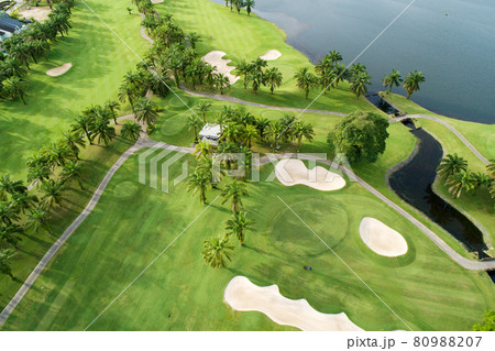 Aerial view of the green golf course in Thailand Beautiful green grass and trees on a golf field with fairway and putting green in summer season 80988207