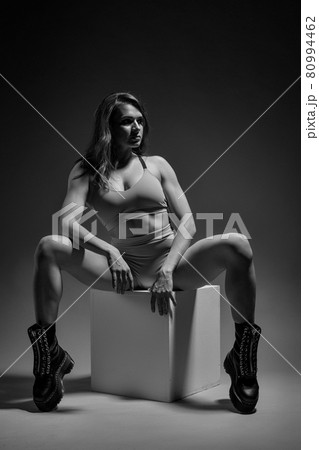 Beautiful sporty girl posing on cubes 80994462