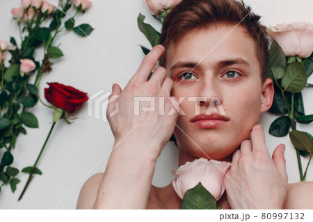 Young man model with flowers. Beauty boy portrait. Young man model with flowers. Beauty boy portrait. 80997132