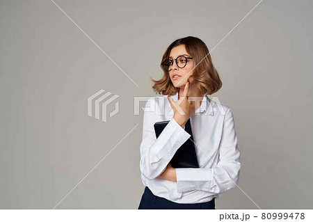 Business woman in white shirt documents professional office 80999478