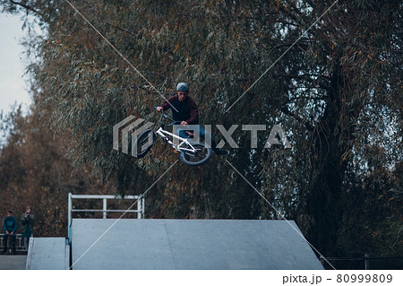 Professional young sportsman cyclist with bmx bike at skatepark. 80999809