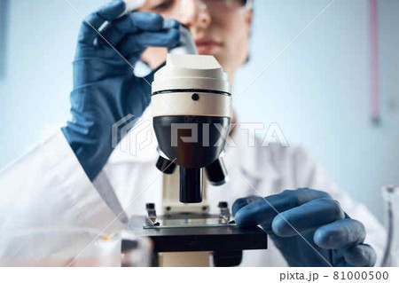 woman scientist laboratory microscope research 81000500