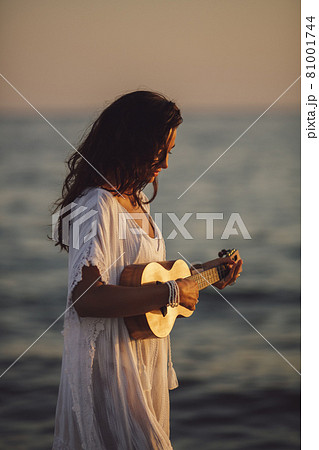 Musician Woman with Ukulele on the Beach Summer Vacation Musician Woman with Ukulele on the Beach Summer Vacation 81001744