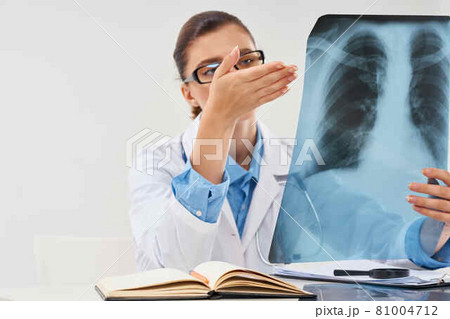 Doctor sits at the table x-ray picture radiologist research Doctor sits at the table x-ray picture radiologist research 81004712