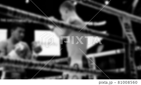 Thai Kick boxing. Blurred images of Muay Thai. Martial Art Kickboxing. Local and foriegn boxer are fighting on the ring at stadium stage. Muaythai is sport competition for traveller sightseeing. 81008560