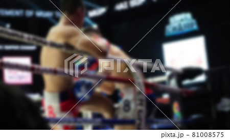 Thai Kick boxing. Blurred images of Muay Thai. Martial Art Kickboxing. Local and foriegn boxer are fighting on the ring at stadium stage. Muaythai is sport competition for traveller sightseeing. 81008575