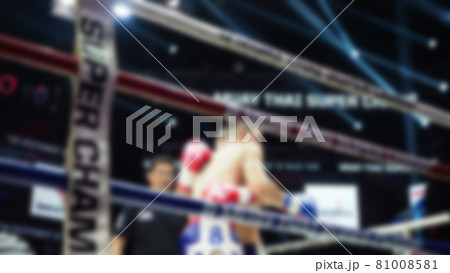 Thai Kick boxing. Blurred images of Muay Thai. Martial Art Kickboxing. Local and foriegn boxer are fighting on the ring at stadium stage. Muaythai is sport competition for traveller sightseeing. Thai Kick boxing. Blurred images of Muay Thai. Martial Art Kickboxing. Local and foriegn boxer are fighting on the ring at stadium stage. Muaythai is sport competition for traveller sightseeing. 81008581