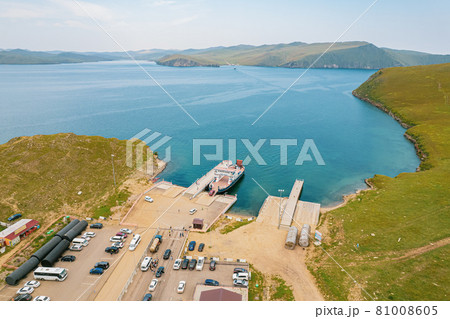 A ferry from the east coast to Olkhon Island Khuzhir at sunrise. Lake Baikal. From the side of the island. 81008605