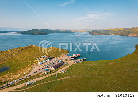 A ferry from the east coast to Olkhon Island Khuzhir at sunrise. Lake Baikal. From the side of the island. A ferry from the east coast to Olkhon Island Khuzhir at sunrise. Lake Baikal. From the side of the island. 81010118