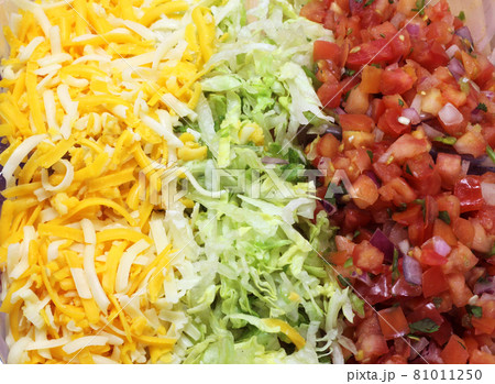 Cheese, Lettuce and Tomato for Fajitas Dinner close up Cheese, Lettuce and Tomato for Fajitas Dinner close up 81011250