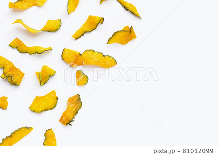 Green pumpkin slice chips on white background. Green pumpkin slice chips on white background. 81012099