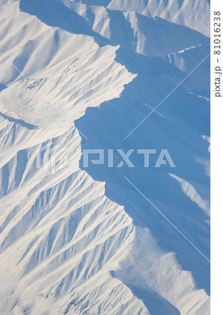 Aerial view of snow-capped mountains 81016238