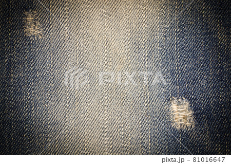 Vintage jeans torn denim texture. Vintage jeans torn denim texture. 81016647