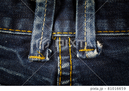 Closeup sewing line of vintage blue jeans 81016659