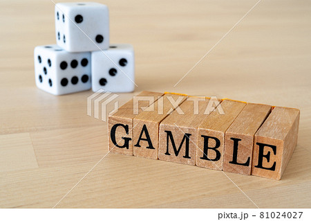 ギャンブル｜「GAMBLE」と書かれたスタンプとサイコロの写真素材