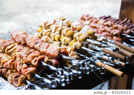 Meat and potatoes prepared for frying on skewers. Meat and potatoes prepared for frying on skewers. 81026321