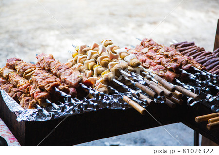 Meat and potatoes prepared for frying on skewers. Meat and potatoes prepared for frying on skewers. 81026322