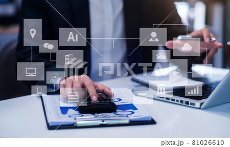 Business women or accountant working on laptop computer with business document, graph diagram and calculator on office table in office. Business women or accountant working on laptop computer with business document, graph diagram and calculator on office table in office. 81026610