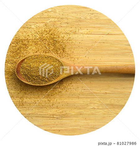 Aromatic fragrant organic cumin powder spice, bamboo in wooden spoon on cutting board Aromatic fragrant organic cumin powder spice, bamboo in wooden spoon on cutting board 81027986