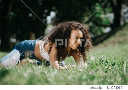 athletic young woman relaxing after a workout . athletic young woman relaxing after a workout . 81028994