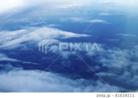 blue sky with white clouds. Puffy clouds horizon. View from the airplane window. DARK BLUE CLOUDS BACKGROUND, NATURE BLUE SKIES. Atmosphere of Earth Sky Blue Daytime, Dark blue background 81029211