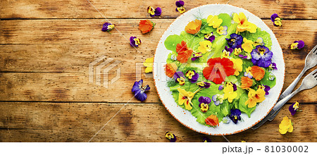 Edible flower salad in the plate,copy space Edible flower salad in the plate,copy space 81030002