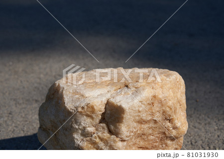 The concept of a summer layout for a product presentation. The platform is made of beige stone on the asphalt. The concept of a summer layout for a product presentation. The platform is made of beige stone on the asphalt. 81031930