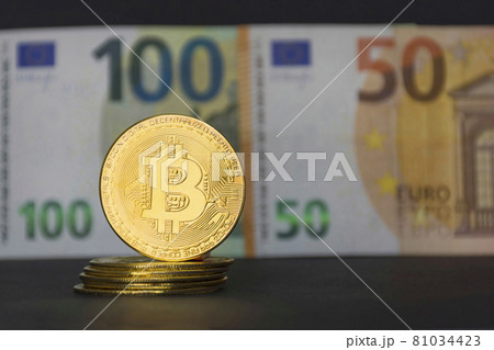 The new virtual money Bitcoin BTC crypto gold coins and Euro currency, selective focus 81034423