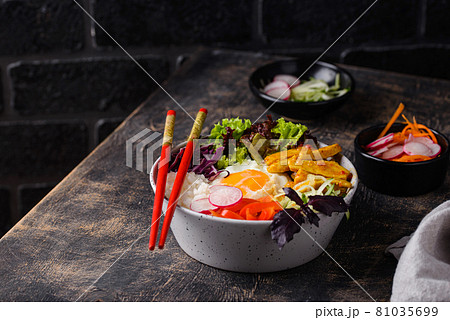Korean Bibimbap. Bowl with meat, rice and salad 81035699