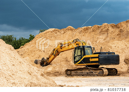 Yellow excavator during earthmoving at open pit Yellow excavator during earthmoving at open pit 81037738