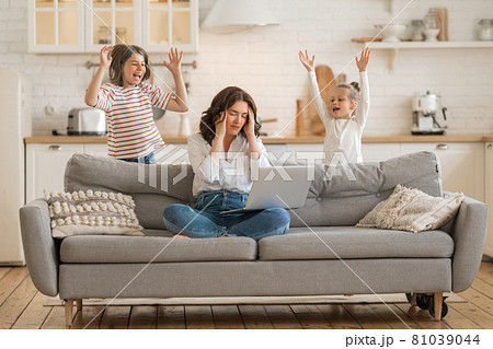 woman working on a laptop at home. woman working on a laptop at home. 81039044