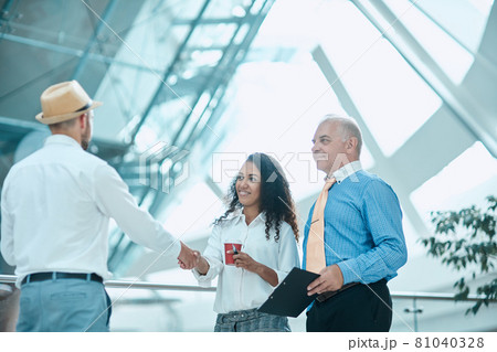 businesswoman meeting her business colleague with a handshake. businesswoman meeting her business colleague with a handshake. 81040328