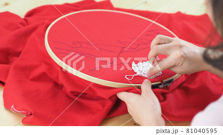 Woman hands and craft work. Embroider sewing by hand. Handicraft work by thread needle sew knit. Wood frame embroidery hoop. Needlework handicraft crafting quarantine leisure concept. Woman hands and craft work. Embroider sewing by hand. Handicraft work by thread needle sew knit. Wood frame embroidery hoop. Needlework handicraft crafting quarantine leisure concept. 81040595