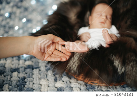 close-up. mother caresses a sleeping newborn baby. close-up. mother caresses a sleeping newborn baby. 81043131