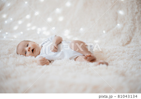 wonderful newborn baby lying on a soft blanket. wonderful newborn baby lying on a soft blanket. 81043134