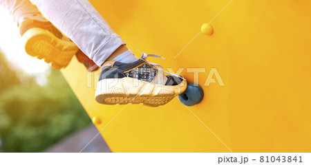 Close up image of a child's foot on a climbing wall Close up image of a child's foot on a climbing wall 81043841