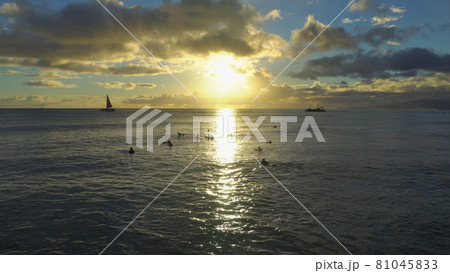 Amazing colors of tropical sunset. Sail boats silhouettes floating on ocean horizon. Oahu island, Hawaii summer vacation. 81045833