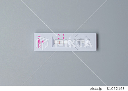Rapid Antigen Test kit with Positive result during swab COVID-19 testing. Coronavirus Self nasal or Home test, Lockdown and Home Isolation concept Rapid Antigen Test kit with Positive result during swab COVID-19 testing. Coronavirus Self nasal or Home test, Lockdown and Home Isolation concept 81052163