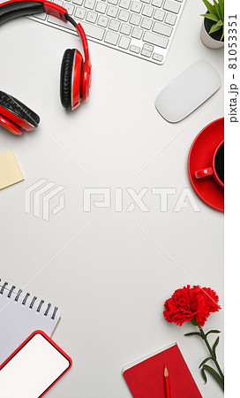 Top view white office desk with smart phone, headphone and coffee cup. Top view white office desk with smart phone, headphone and coffee cup. 81053351