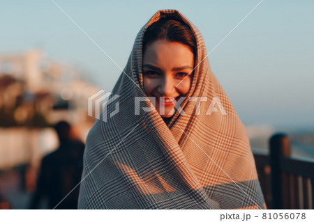 Young woman in a headscarf funny portrait 81056078