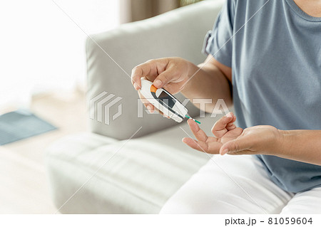 Asian woman checking blood sugar level by Digital Glucose meter, Healthcare and Medical, diabetes, glycemia concept Asian woman checking blood sugar level by Digital Glucose meter, Healthcare and Medical, diabetes, glycemia concept 81059604