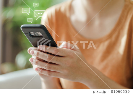 Young Asian woman using smartphone typing, chatting conversation . Social Network, technology concept 81060559